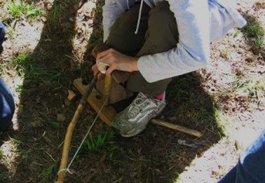 Fire making with a bow drill